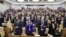 Russia -- Attendees stand during a plenary meeting of the Russian State Duma