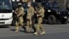 Bishkek, Kyrgyzstan - Members of Kyrgyz armed forces walk in Ala-Too Square after President Sooronbai Jeenbekov declared a state of emergency in the capital and ordered troops to be deployed ther