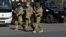 Bishkek, Kyrgyzstan - Members of Kyrgyz armed forces walk in Ala-Too Square after President Sooronbai Jeenbekov declared a state of emergency in the capital and ordered troops to be deployed ther