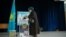 Kazakhstan -- A woman is casting her vote at the 206 Polling station. Almaty, 20Mar2016