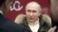 RUSSIA -- Russian President Vladimir Putin speaks with journalists as he attends a concert marking the seventh anniversary of Russia's annexation of Crimea at Luzhniki Stadium in Moscow, Russia March 18, 2021. 