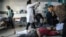 Palestinians receive medical care at Kamal Edwan Hospital in Beit Lahia, in the northern Gaza Strip, on February 29, 2024, after Israeli soldiers allegedly opened fire at Gaza residents who rushed towards trucks loaded with humanitarian aid amid ongoing b