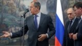 Сергей Лавров во время встречи с главами МИД сепаратистских Абхазии и Южной Осетии Давидом Санакоевым и Вячеславом Чирикбой в 2014 году