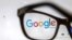 RUSSIA -- Glasses in front of a computer screen shows a Google sign - generic