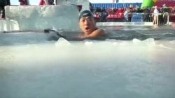Любители зимнего плавания соревнуются в Харбине