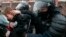 RUSSIA -- Police officers detain a young demonstrator during a protest near the Matrosskaya Tishina prison where Alexei Navalny is being held, in Moscow, Russia, on Sunday, Jan. 31, 2021.