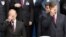 UKRAINE – Russian President Vladimir Putin (L) and Ukrainian President Viktor Yanukovych (R) cross themselves during a service and the ceremony in Kiev on July 27, 2013, marking the 1025th anniversary of Christianity of Kyivan Rus