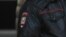 RUSSIA -- Russian police officers wearing masks stand guard as passengers, who arrived at Sheremetyevo International Airport on a flight from New York amid the coronavirus (COVID-19) pandemic, board buses outside a terminal building near Moscow, April 8, 