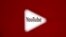 A 3D-printed YouTube icon is seen in front of a displayed YouTube logo - generic