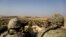 SYRIA -- U.S. troops look toward the border with Turkey from a small outpost near the town of Manbij, northern Syria, February 7, 2018