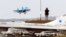 UKRAINE – A journalist takes a picture of an Ukrainian Su-27 jet fighter during the Clear Sky 2018 military exercise on the Starikostyantyniv airbase in Khmelnitskiy area, 12 October 2018