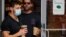 People wear masks against the coronavirus disease (COVID-19), following the CDC recommendation that fully vaccinated Americans wear masks as the highly transmissible Delta variant has led to a surge in infections, in Times Square in New York City, New Yor
