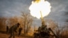 UKRAINE – A Ukrainian servicewoman together with other artillery colleagues fires from the 2S7 "Pion" self-propelled guns at the positions of the Russian army. Kherson region, November 9, 2022