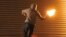 U.K. --A masked nationalist throws a Molotov cocktail at the police on July 14, 2010 during the third night of Nationalist rioting in Belfast.