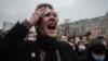 An injured young protester yells at Moscow's unauthorized January 23, 2021 rally for opposition leader Aleksei Navalny's release from prison. 