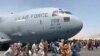 AFGHANISTAN -- Afghan people try to block the U.S. Air Force plane at the Hamid Karzai airport in Kabul
