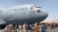 AFGHANISTAN -- Afghan people try to block the U.S. Air Force plane at the Hamid Karzai airport in Kabul