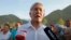 Kyrgyz ex-President Almazbek Atambaev attends a meeting with his supporters in the village of Koi-Tash on July 19, 2019.