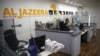 (FILES) An employee of the Qatar based news network and TV channel Al-Jazeera is seen at the channel's Jerusalem office on July 31, 2017.