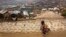 BANGLADESH --  In this Monday, Jan. 15, 2018, file photo, a Rohingya boy holds his sibling as they sit on the side of a dirt road in the Balukhali refugee camp 50 kilometers (32 miles) from, Cox's Bazar, Bangladesh. Bangladesh officials say they have agre