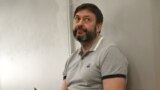 UKRAINE -- Ukrainian-Russian journalist Kyrylo Vyshynskiy sits on the dock prior to the Kyiv's Appeal Court hearing, in Kyiv, August 13, 2019