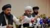 Taliban representatives Abdul Latif Mansoor (left), Shahabuddin Delawar, and Suhail Shaheen attend a July 9, 2021 news conference in Moscow, Russia. 