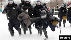Russian police detain a man during St. Petersburg's unauthorized January 31 protest for the release of jailed opposition leader Aleksei Navalny. 