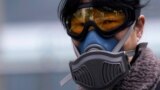 Shanghai, China - A woman wearing a mask is seen at a subway station in Shanghai, China, as the country is hit by an outbreak of the novel coronavirus