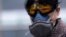 Shanghai, China - A woman wearing a mask is seen at a subway station in Shanghai, China, as the country is hit by an outbreak of the novel coronavirus