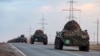 Российские бронетраспортеры (БТР) едут в сторону аэропорта для транспортировки в зону конфликта Нагорного Карабаха. 10 ноября 2020 года