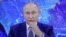 UKRAINE -- Russian President Vladimir Putin is seen on a tv screen during his annual end-of-year news conference, held online in a video conference mode, in a shop in Yevpatoria, Crimea, December 17, 2020