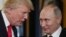 VIETNAM -- U.S. President Donald Trump (L) speaks with Russian President Vladimir Putin as they attend the APEC Economic Leaders' Meeting in Danang, November 11, 2017