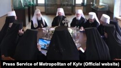 Top figures in Ukraine's new Orthodox Church meet in a synod in Kyiv on May 24, including Patriarch Filaret (left) and Metropolitan Epifaniy (center).