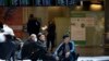 RUSSIA -- Tajikistan's people rest on the floor waiting for a plane to return in their home country at the Vnukovo international airport, 35 km (22,5 mikes) southwest of Moscow, Russia, Tuesday, March 24, 2020.