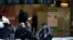 RUSSIA -- Tajikistan's people rest on the floor waiting for a plane to return in their home country at the Vnukovo international airport, 35 km (22,5 mikes) southwest of Moscow, Russia, Tuesday, March 24, 2020.