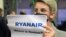 LIHTUANIA-BELARUS - A woman stands with a poster reading 'Where is Roman (Protasevich)?!' in the arrival area. Vilnius, 23May2021