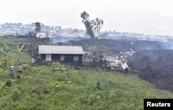 Потоки лавы подошли вплотную к городу и разрушили дома в окрестностях Гомы. 23 мая 2021 года. Фото: Reuters