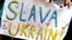 ARGENTINA – A demonstrator holds a sign that reads "Glory to Ukraine" while protesting Russia's massive military operation against Ukraine, in Buenos Aires, Argentina, February 25, 2022