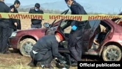 Police inspect the car allegedly used to kidnap Aizada Kanatbekova,