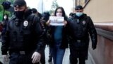 RUSSIA -- Russian police officers detain a participant for staging a picket in support of journalist Ilya Azar, following a court's decision to jail him for his one-person protest, in Moscow, May 29, 2020