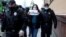 RUSSIA -- Russian police officers detain a participant for staging a picket in support of journalist Ilya Azar, following a court's decision to jail him for his one-person protest, in Moscow, May 29, 2020