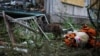 UKRAINE – A cat stands near a toy tiger in front of an apartment building destroyed in a missile strike, amid Russia's invasion of Ukraine, in Bakhmut, Donetsk region, June 13, 2022