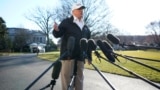 Donald Trump talks to reporters as he departs for a visit to the U.S. southern border area