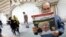 IRAN -- An Iranian man reads a copy of the daily newspaper 'Omid Javan' bearing a picture of US President Donald Trump with a headline that reads in Persian "Crazy Trump and logical JCPOA (Joint Comprehensive Plan of Action)", inTehran, October 14, 2017