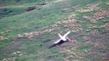 NAGORNO KARABAKH -- A still image taken from a handout video footage released 29 September 2020 by the Armenian Defense Ministry on its official website claims to show a downed Azeri drone during military clashes along the contact line of the self-proclai