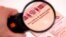 GENERIC – Observing Russain foreign passsport through a magnifying glass