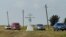 UKRAINE -- Local cars drive past the memorial to victims of the MH17 disaster, near the pro-Russian rebels controlled village of Hrabove, Donetsk region, July 17, 2019
