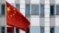 The Chinese flag is pictured in front of the building of the Chinese embassy in Berlin on April 22, 2024.