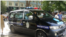 Police car in front of OSCE office in Dushanbe 