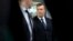 RUSSIA – Ukraine's ousted president Viktor Yanukovych, right, arrives to attend a news conference in Moscow, Russia, Friday, March 2, 2018